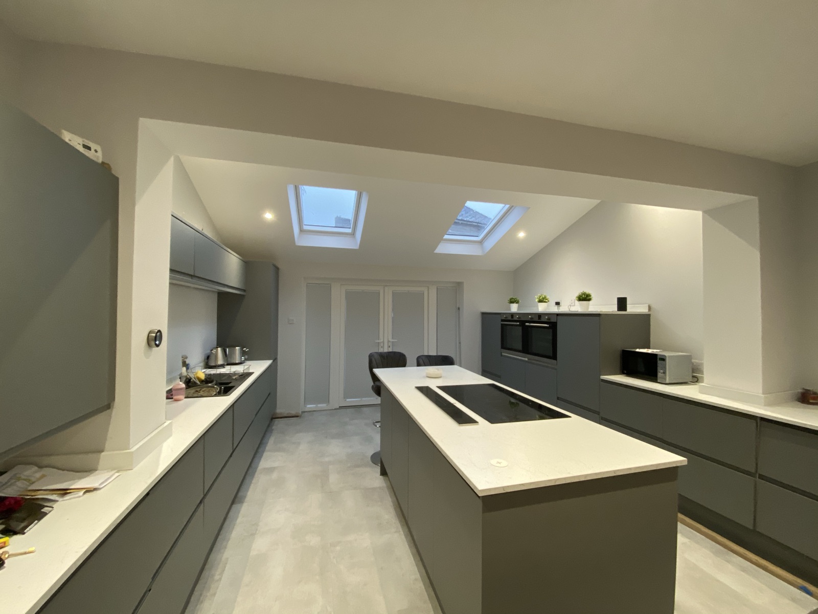 Grey kitchen with an island and rooflights
