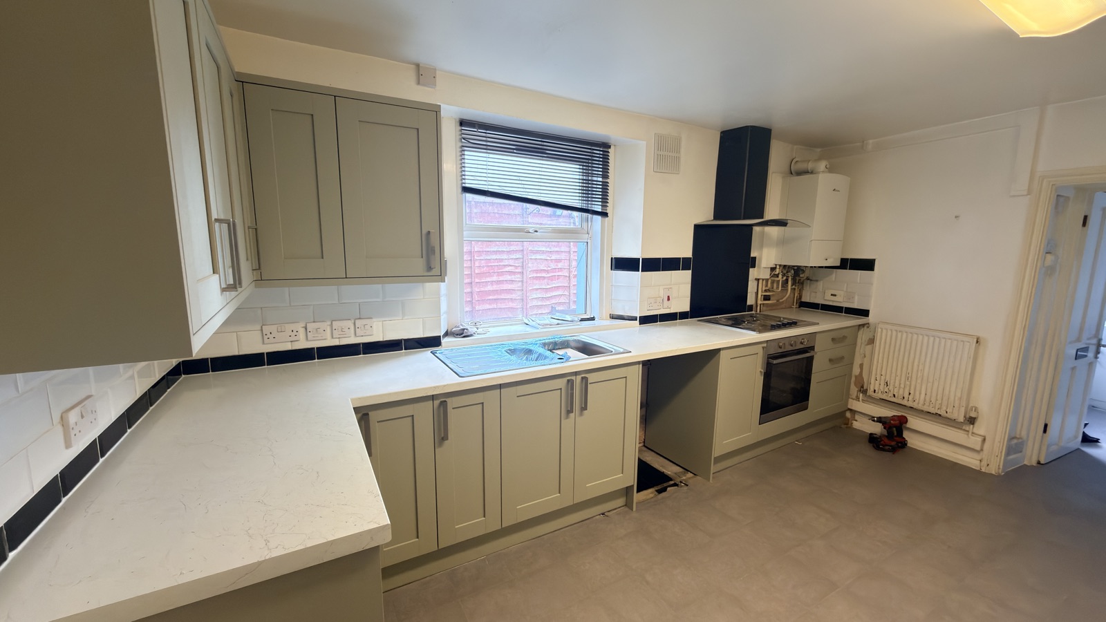 Shaker kitchen installation with worktops and sink